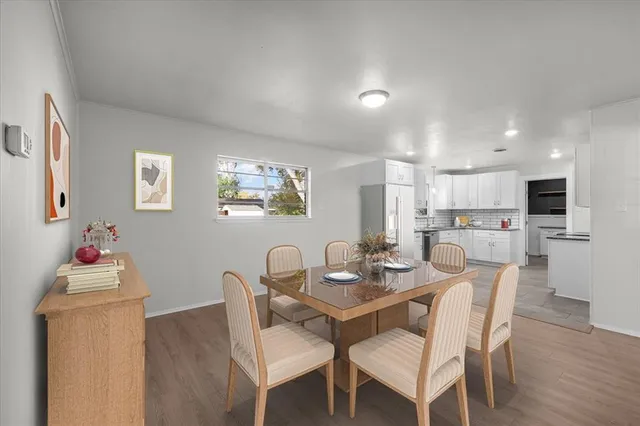 a large kitchen with cabinets and stainless steel appliances