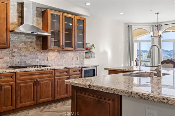 a stove top oven sitting inside of a kitchen
