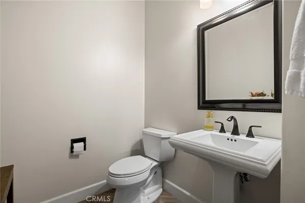 a utility room with sink dryer and washer