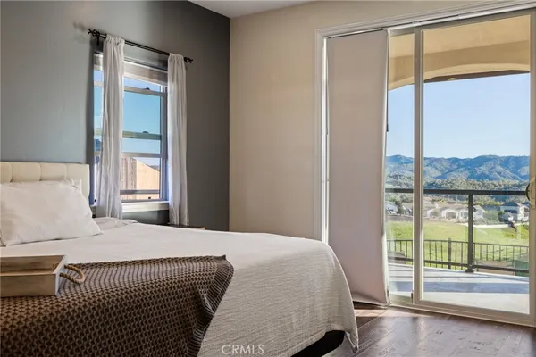 a spacious bathroom with a granite countertop sink and a mirror