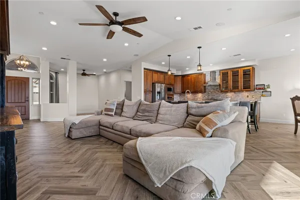 a living room with fireplace furniture and a flat screen tv