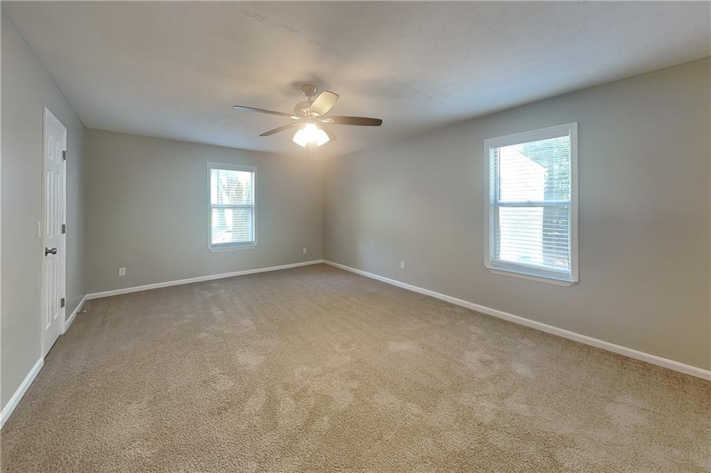 335 Olde Bridge Way Johns Creek, GA 30022 - Photo 8 of 19 a view of empty room with windows