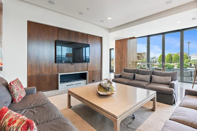 a view of a backyard with sitting area