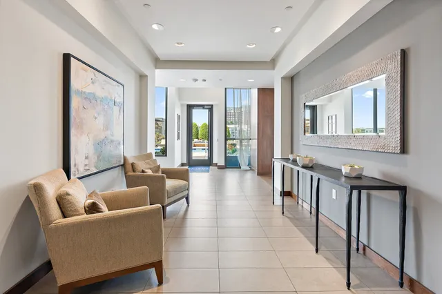 a view of a street with a bench in front of it