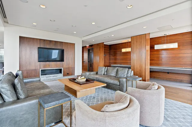 a view of a patio with chairs and plants
