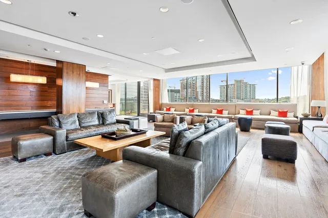 a room with lots of furniture and windows