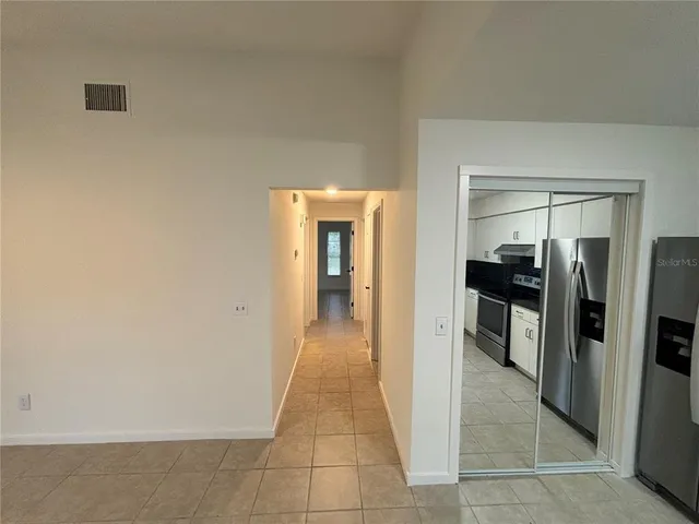 a view of a hallway with a livingroom