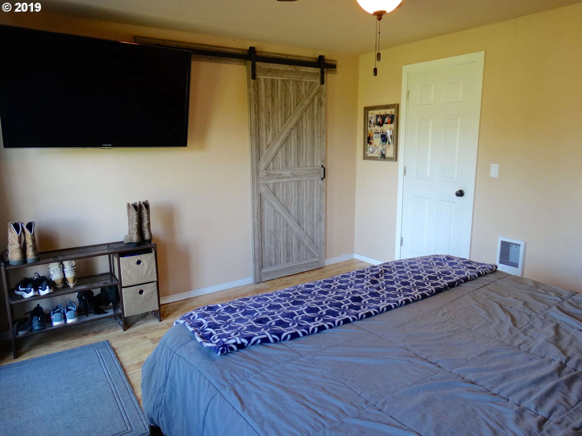 4100 Southwest Dilley Road Forest Grove, OR 97116 - Photo 12 of 27 a bedroom with a bed and a television