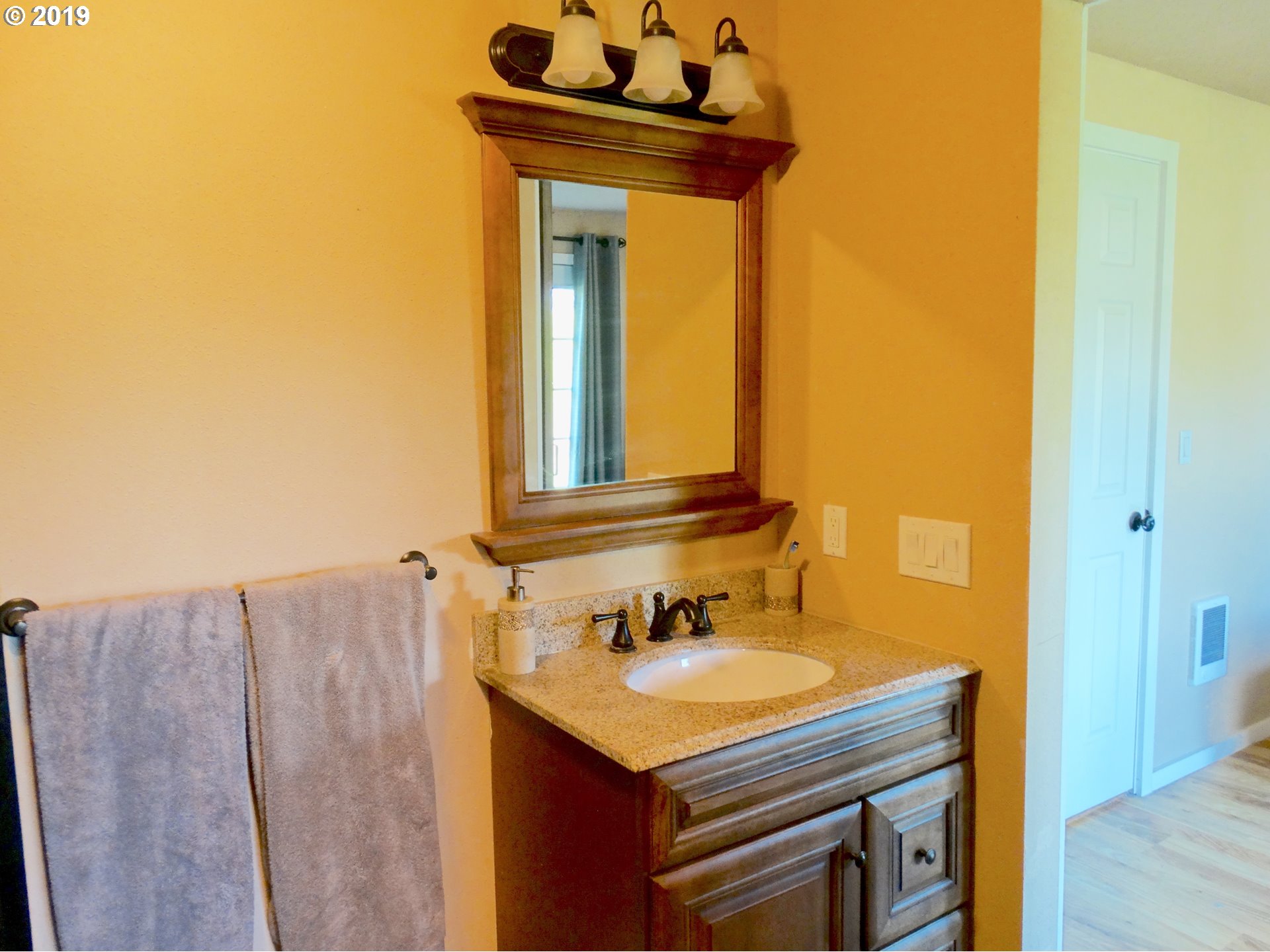 4100 Southwest Dilley Road Forest Grove, OR 97116 - Photo 14 of 27 a bathroom with a sink and a mirror