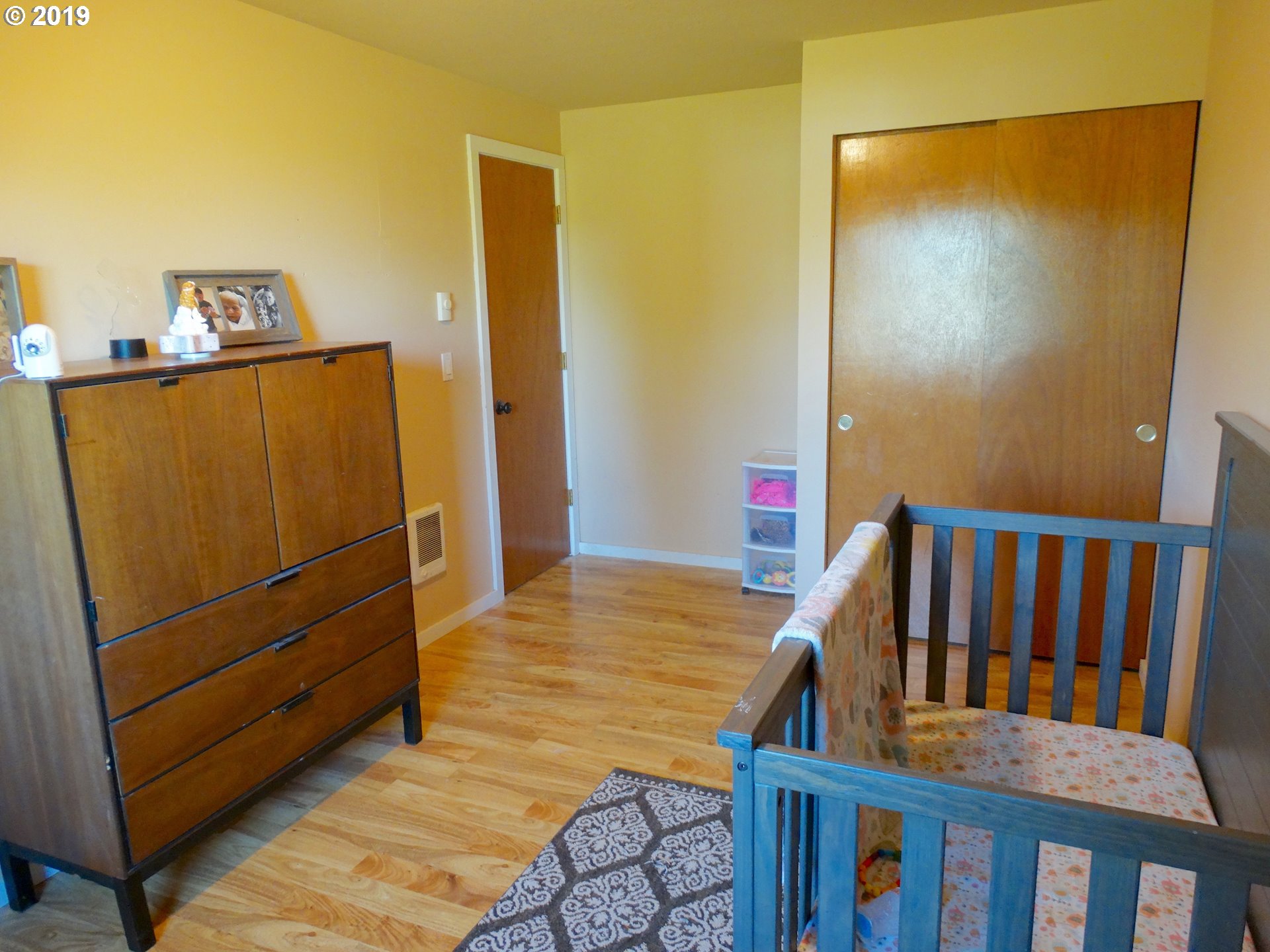 4100 Southwest Dilley Road Forest Grove, OR 97116 - Photo 16 of 27 a view of a bedroom with wooden floor