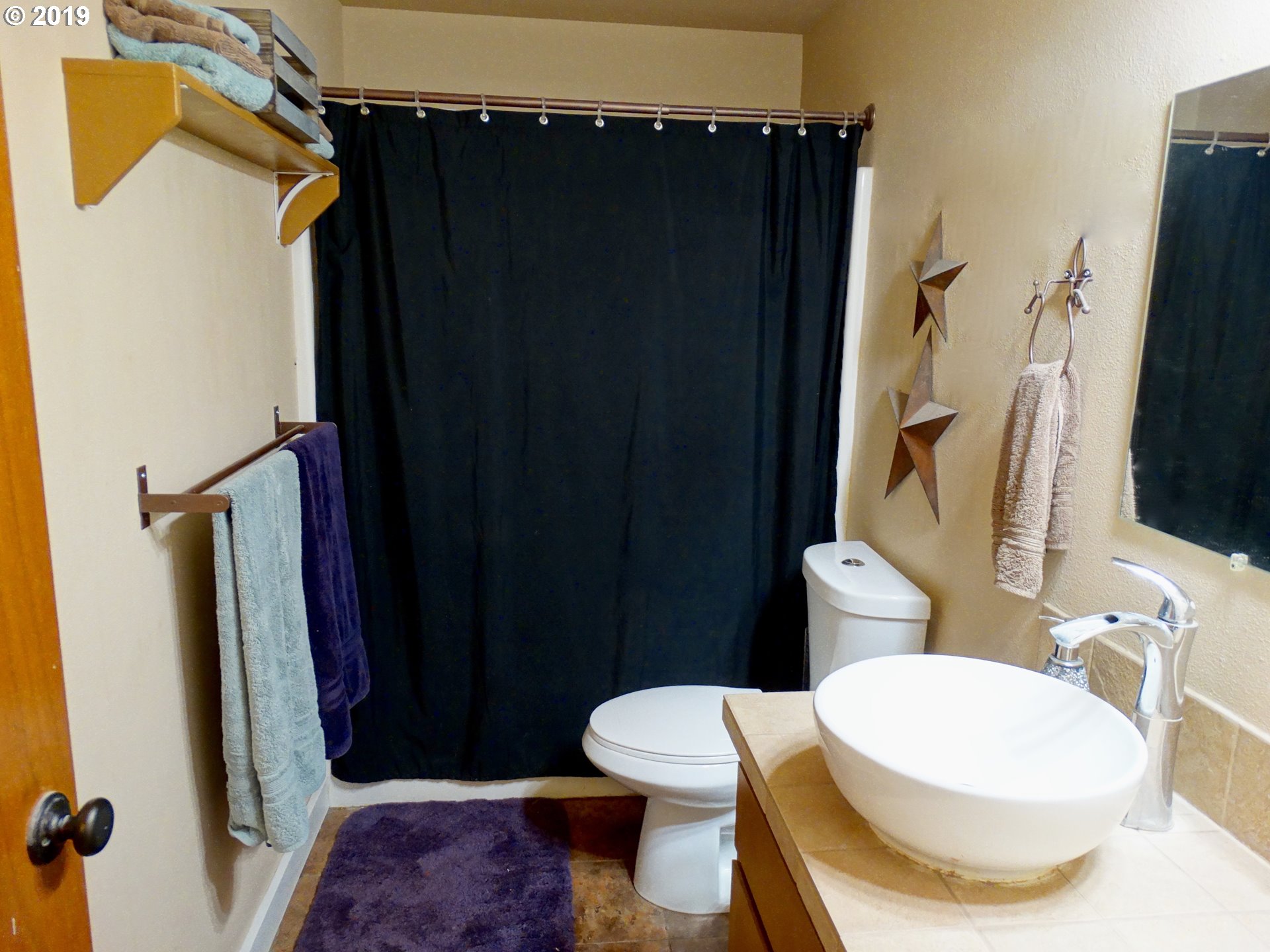 4100 Southwest Dilley Road Forest Grove, OR 97116 - Photo 17 of 27 a bathroom with a sink and a toilet