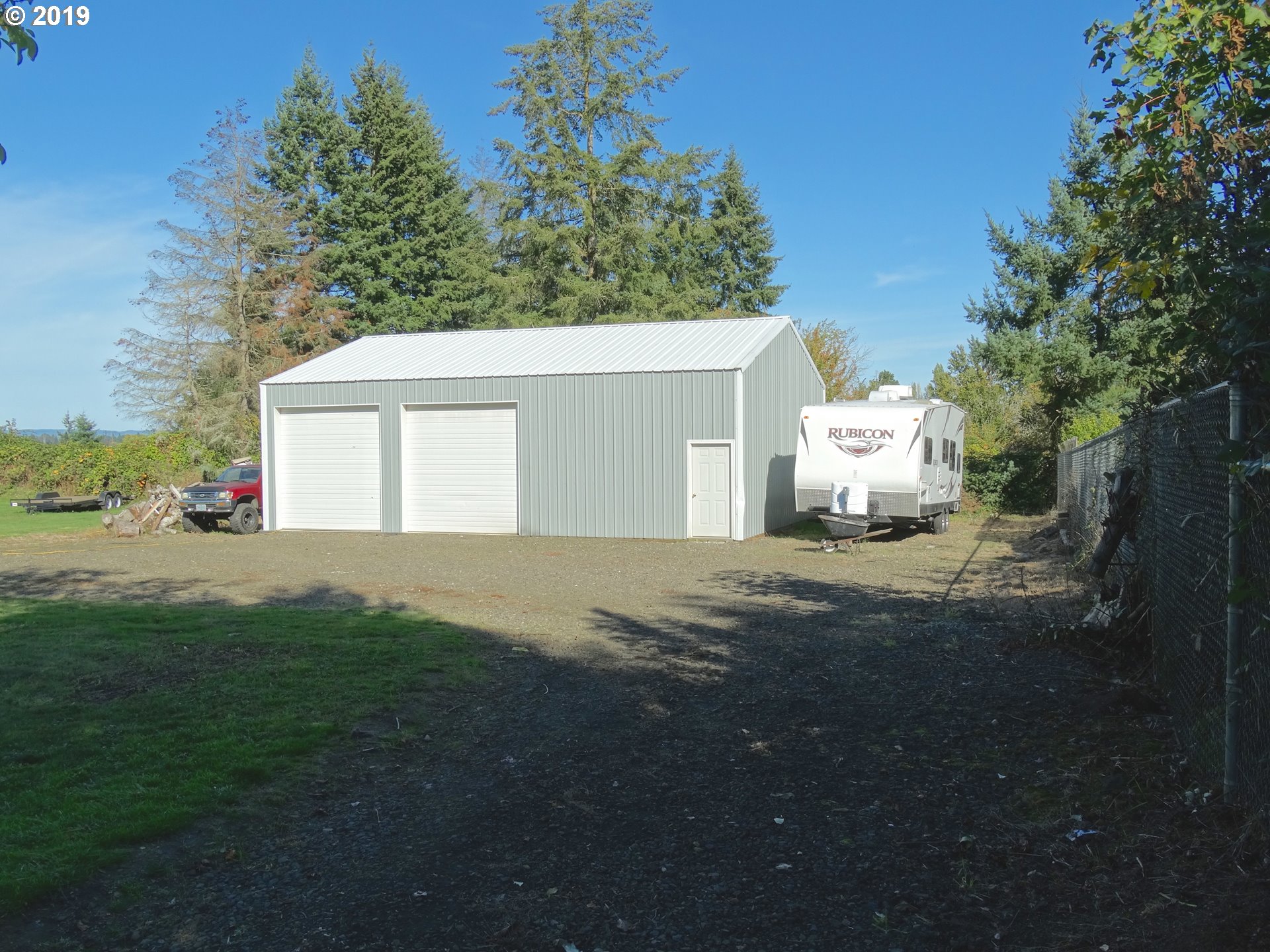 4100 Southwest Dilley Road Forest Grove, OR 97116 - Photo 24 of 27 a view of a white house with a yard