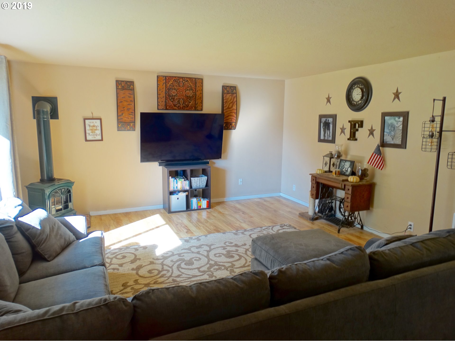 4100 Southwest Dilley Road Forest Grove, OR 97116 - Photo 4 of 27 a living room with furniture and a flat screen tv
