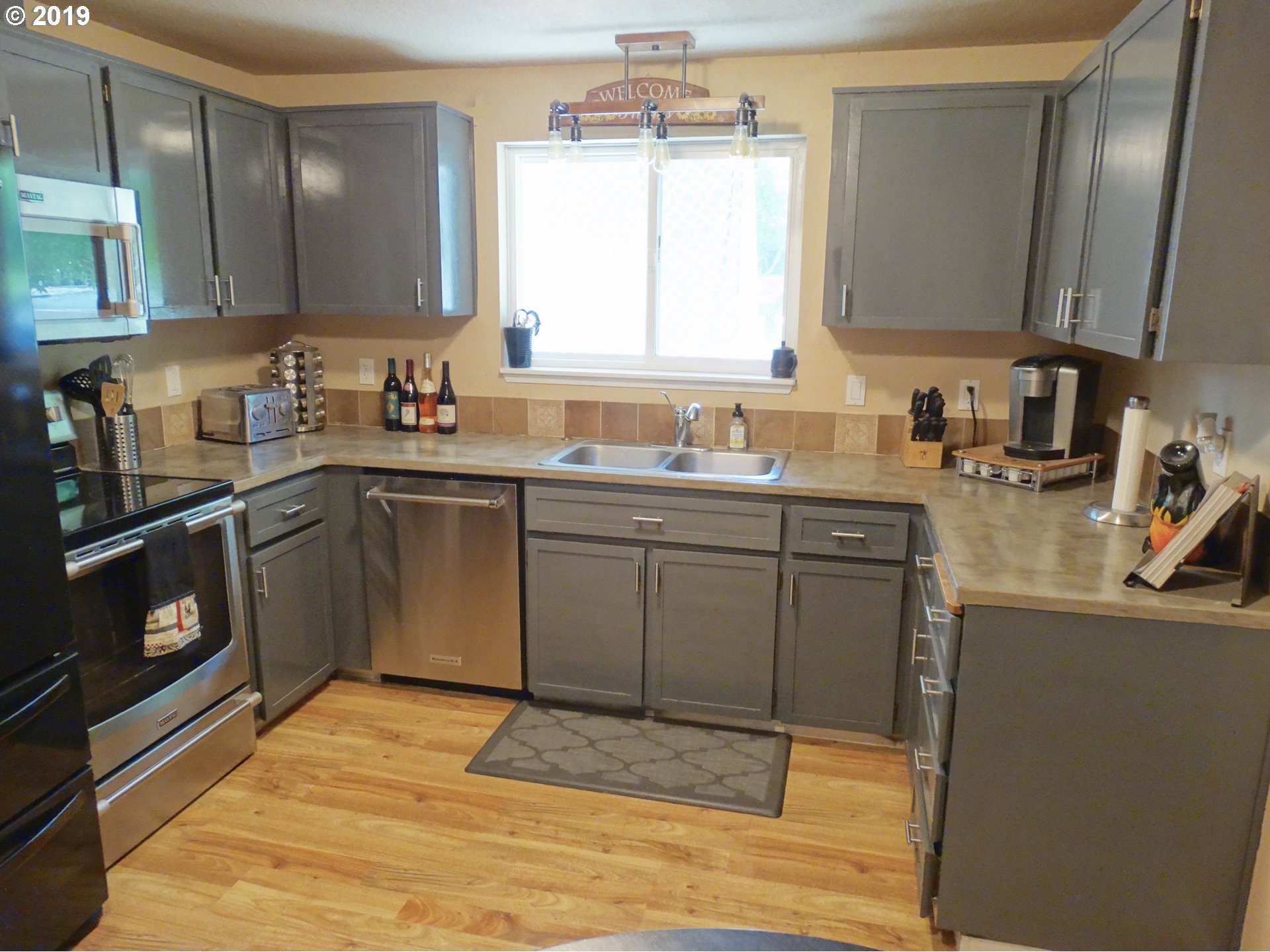 4100 Southwest Dilley Road Forest Grove, OR 97116 - Photo 8 of 27 a kitchen with a sink cabinets and window