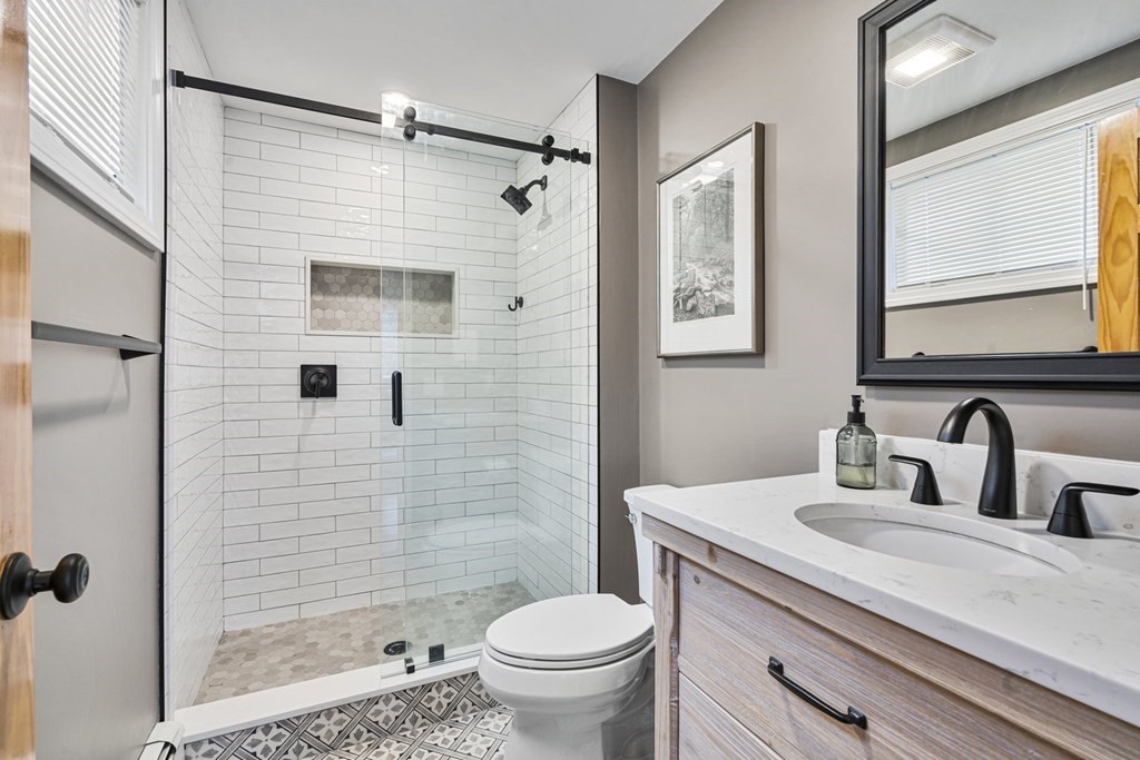 45 Lyndon Road Sharon, MA 02067 - Photo 15 of 31 a bathroom with a sink toilet and shower