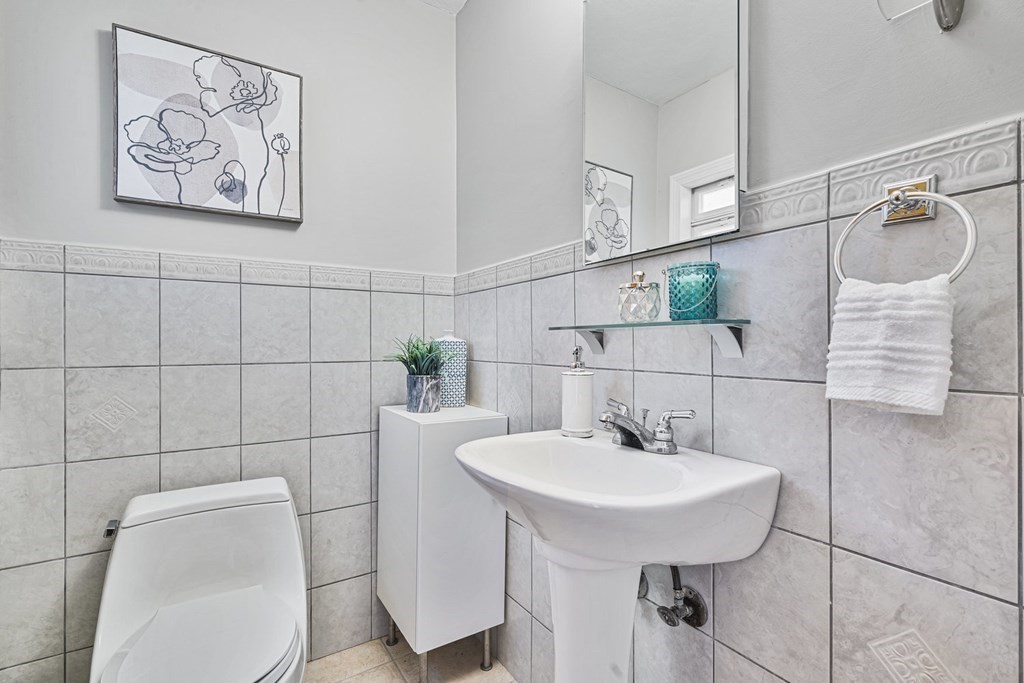 45 Lyndon Road Sharon, MA 02067 - Photo 17 of 31 a bathroom with a toilet sink and mirror