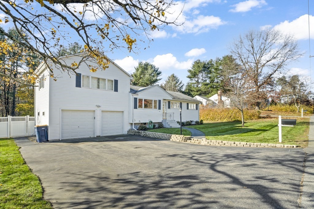45 Lyndon Road Sharon, MA 02067 - Photo 23 of 31 a white house that has a tree on the side of it
