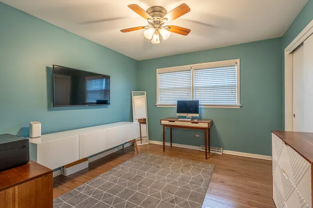 a bedroom with furniture and a window
