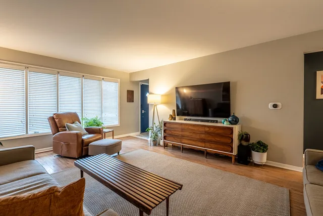 a bedroom with furniture and a flat screen tv