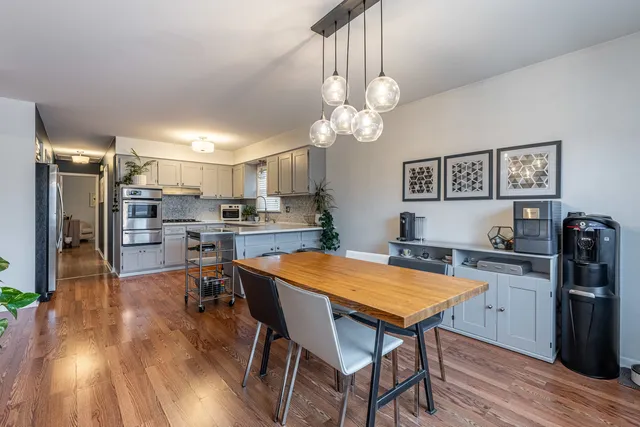 a view of a dining room with furniture and wooden floor