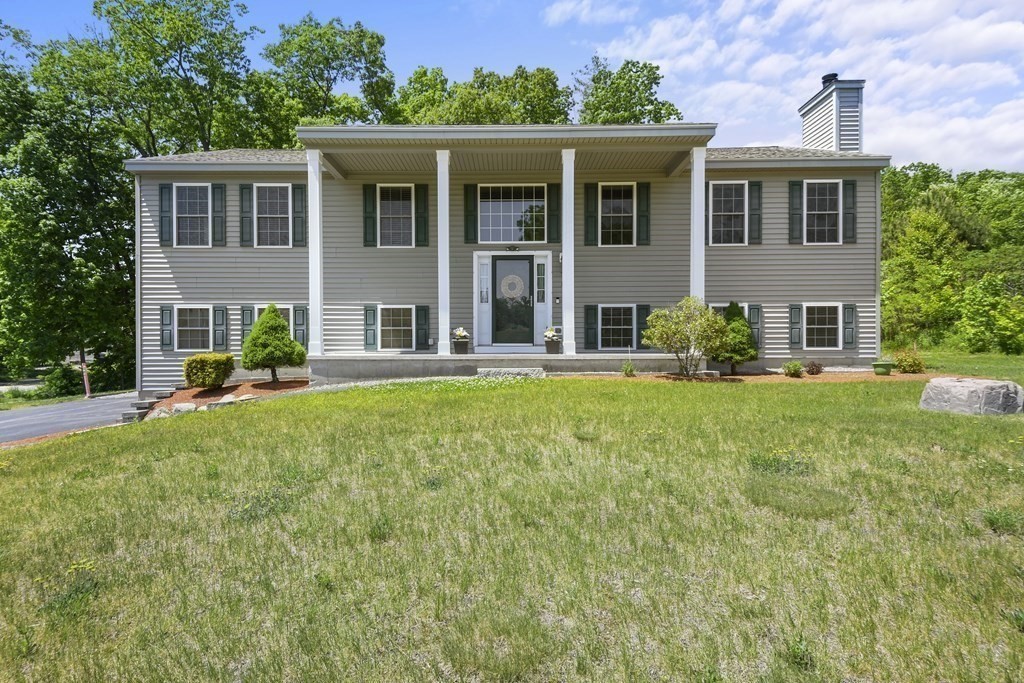 8 Hickory Way Ayer, MA 01432 - Photo 1 of 35 front view of a house with a yard