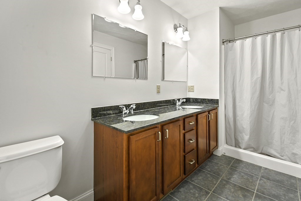 8 Hickory Way Ayer, MA 01432 - Photo 16 of 35 a bathroom with a granite countertop sink and a mirror