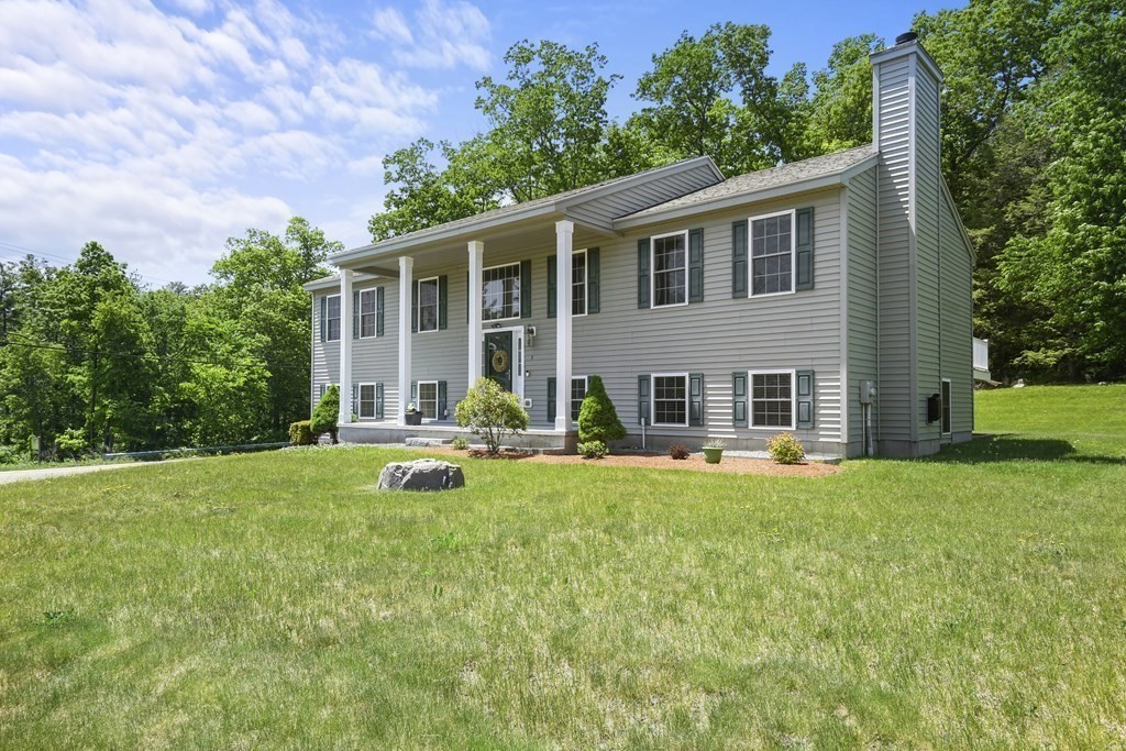8 Hickory Way Ayer, MA 01432 - Photo 2 of 35 a view of a house with a backyard and a patio