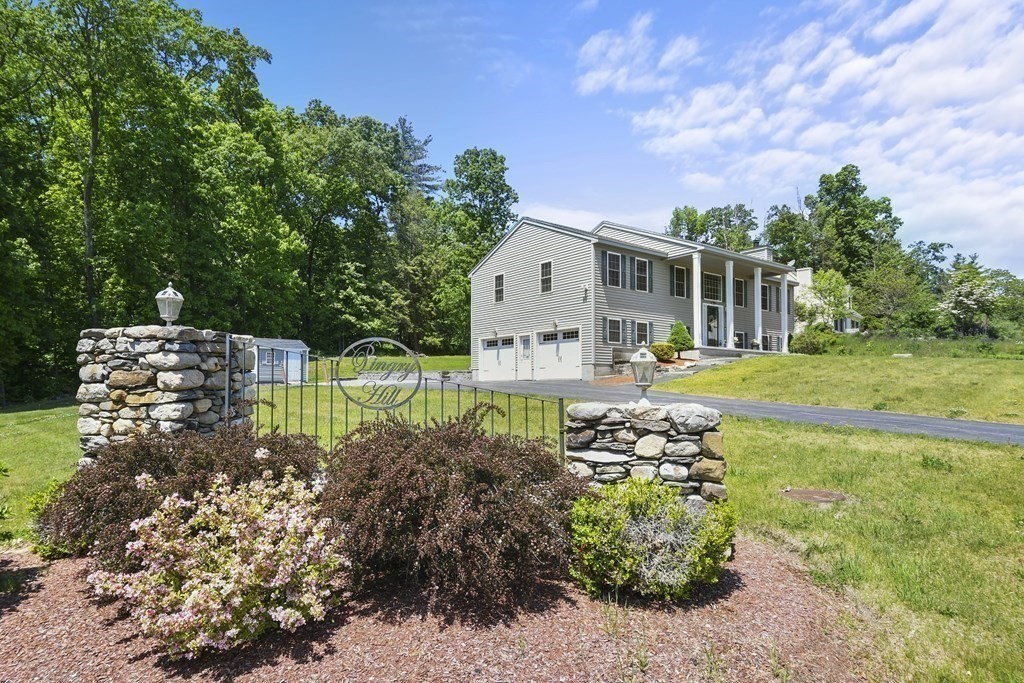 8 Hickory Way Ayer, MA 01432 - Photo 3 of 35 a front view of a house with garden