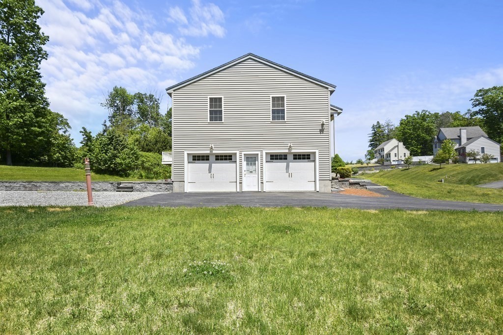 8 Hickory Way Ayer, MA 01432 - Photo 32 of 35 a view of a house with pool and a yard