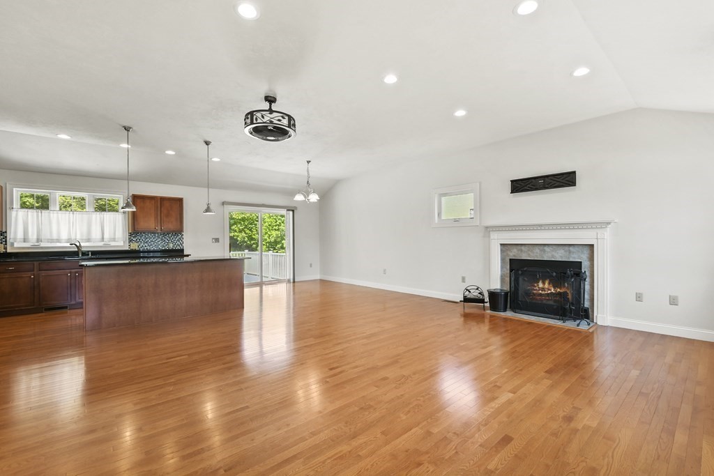 8 Hickory Way Ayer, MA 01432 - Photo 8 of 35 a view of a living room a window and a fireplace