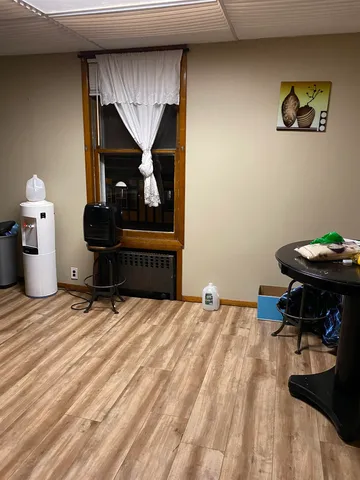 a bedroom with a bed and a table