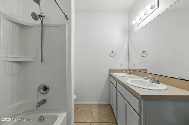 a bathroom with a sink a mirror and a bathtub