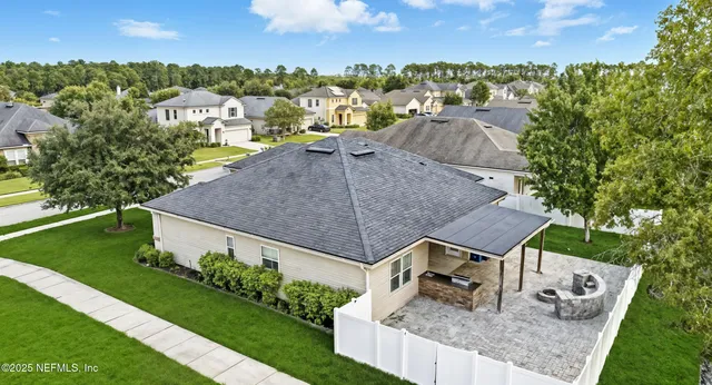an aerial view of a house having yard