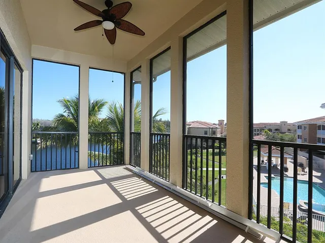 a view of a balcony with a floor to ceiling window