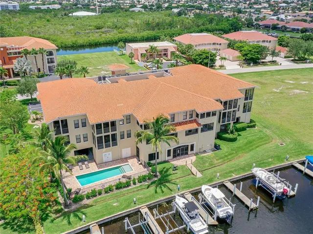 an aerial view of multiple houses with yard