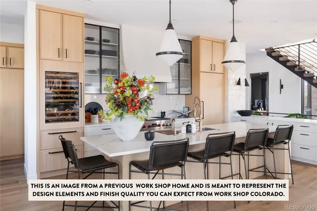 a living room with a fireplace a flat screen tv and a potted plant