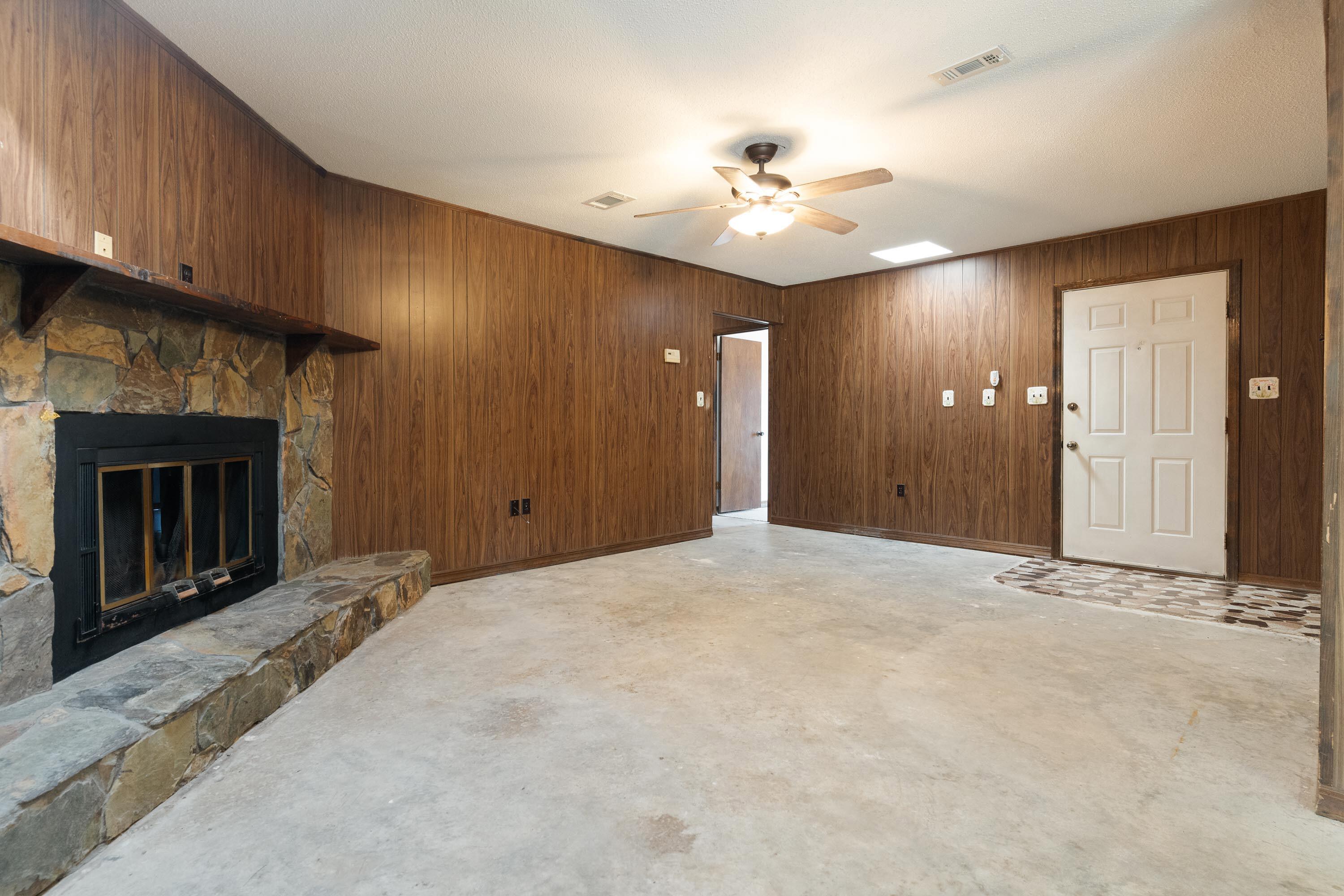 6154 Garden City Road Crestview, FL 32539 - Photo 8 of 34 a view of an empty room with a fireplace