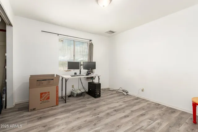 a view of a kitchen with a stove top oven