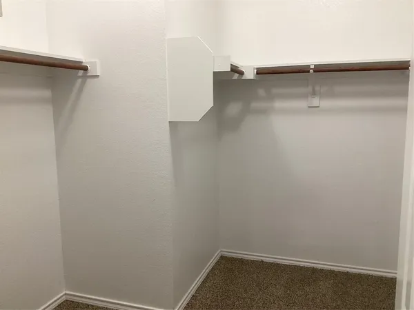 a view of a room with racks on the wall