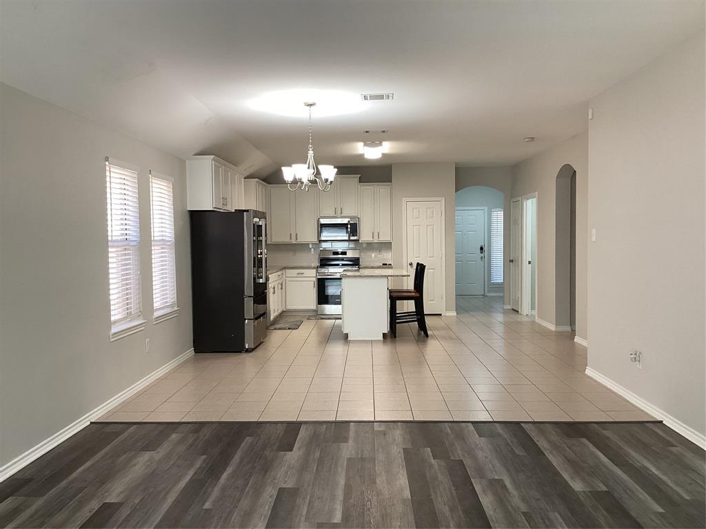 4608 Wolf Ridge Way Fort Worth, TX 76244 - Photo 8 of 23 a view of livingroom with furniture and wooden floor