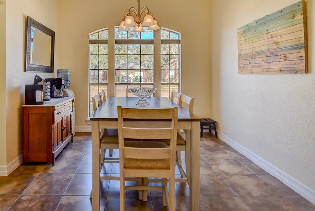 a view of a room with wooden floor and windows