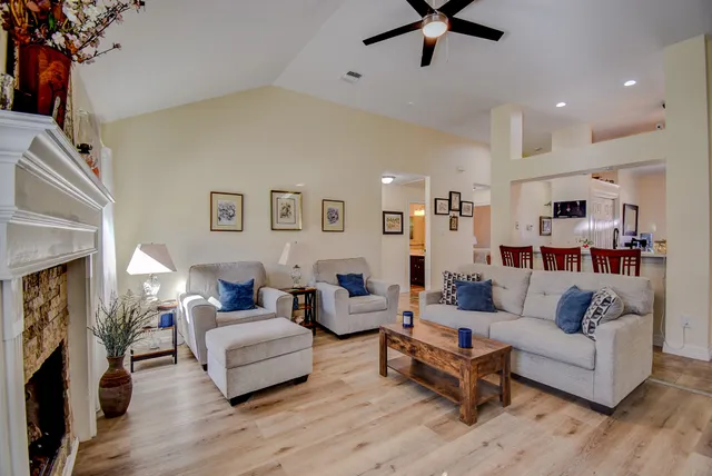 a living room with furniture and a fireplace