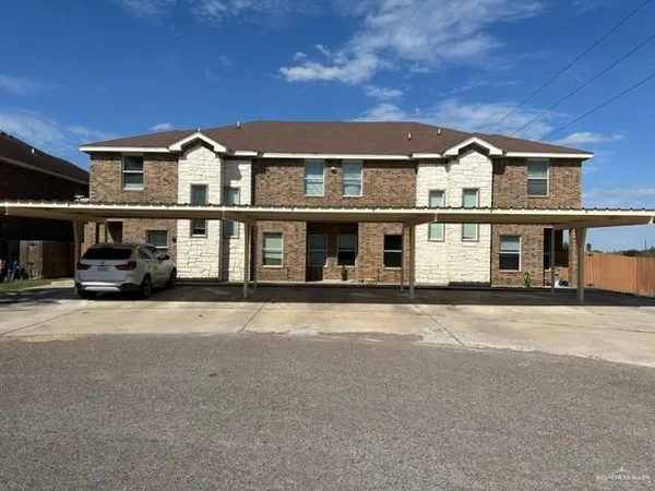 a front view of a building with a street
