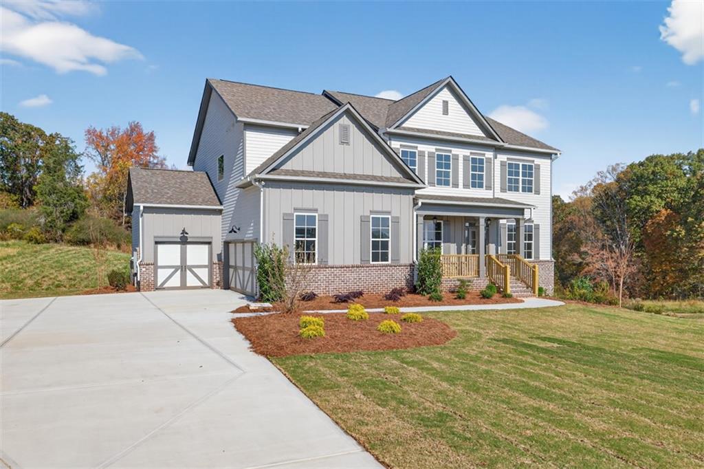 8845 Jot Em Down Road Gainesville, GA 30506 - Photo 4 of 87 a front view of a house with a yard