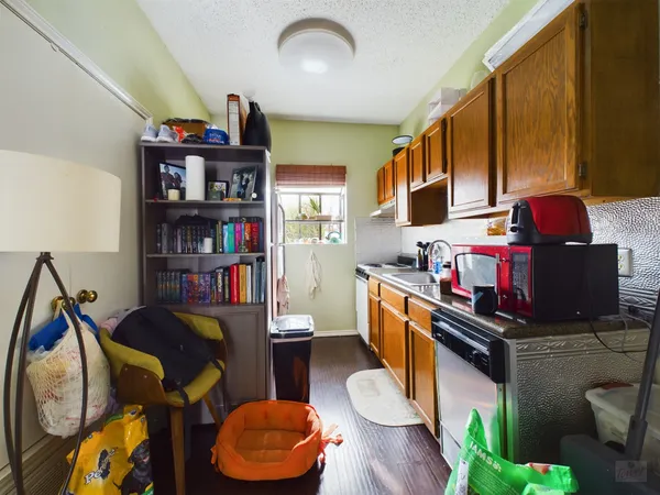 a reading room with furniture a rug and a bookshelf