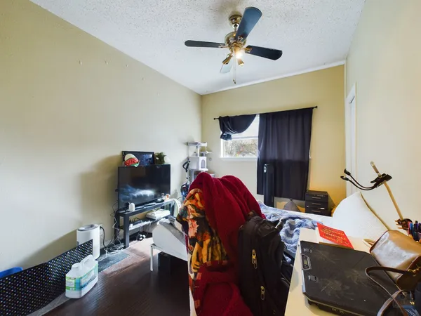 a bedroom with a workspace