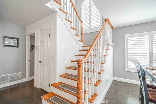 a bathroom with a sink a toilet and shower curtain