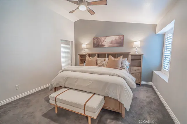 a bedroom with a bed and a furniture