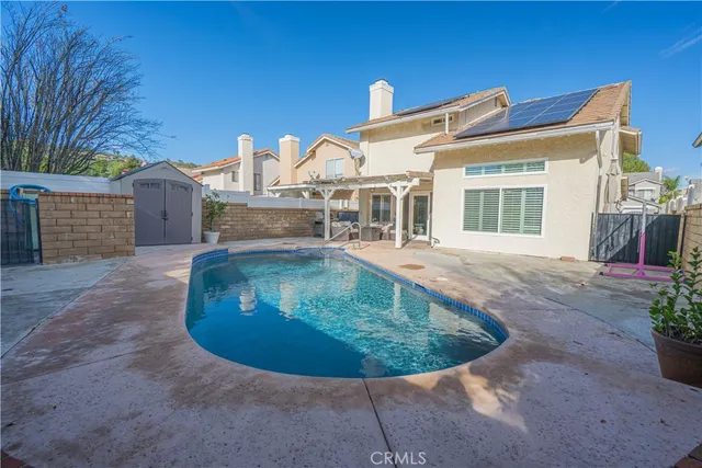a view of a wooden house with a yard