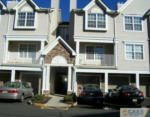 a view of a car park in front of house